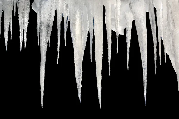 Natural icicles on a black background with saved photoshop clipping Path — Stock Photo, Image