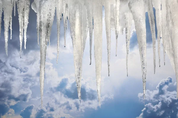 Many natural icicles on sky background with saved photoshop clipping Path — Stock Photo, Image