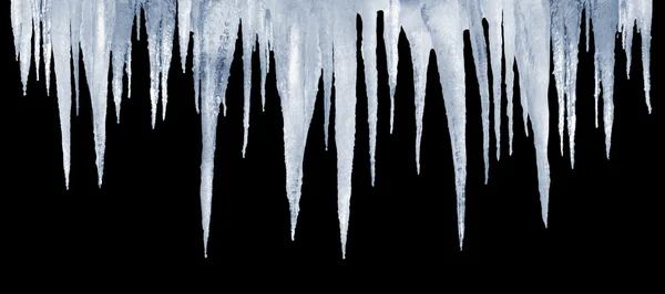 Number of natural icicles on a black background — Stock Photo, Image