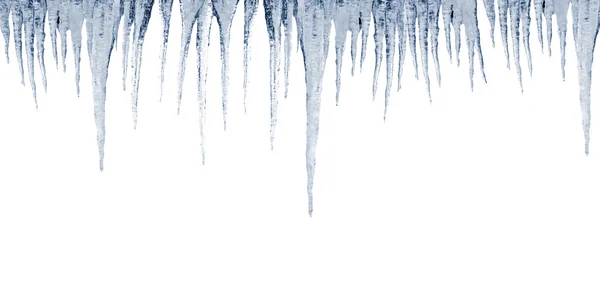 Beyaz zemin üzerine buz sarkıtları — Stok fotoğraf