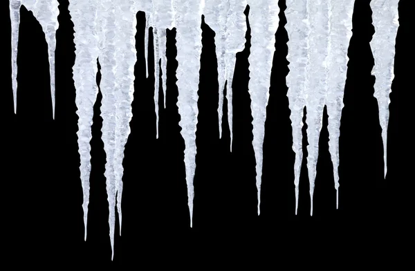 Icicles on black with photoshop path — Stock Photo, Image