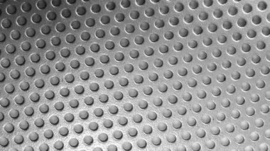 Gray perforated metal plate. Aluminum texture. Holes in metal. Lots of holes. Radiator grille. Element of decor.