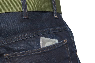 Condom in the back pocket of blue men's jeans