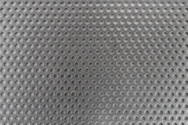 Gray perforated metal plate. Aluminum texture.