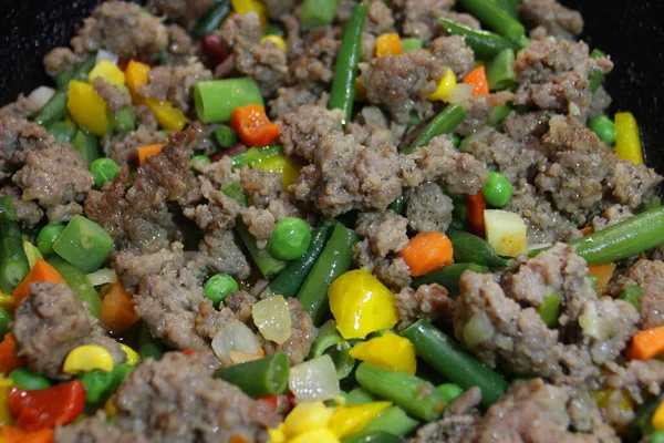 Minced meat with corn, green peas and sweet pepper.