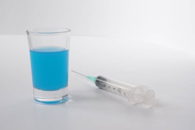 Laboratory tests. Syringe with blue toxin. New antiviral drug.