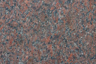 Red granite, which is used in construction.
