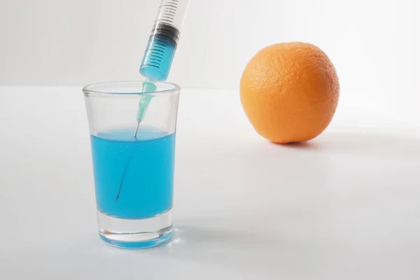 Injection of toxin into an orange. Laboratory tests.