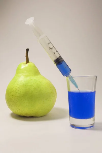 Green Pear Syringe Glass White Background Injection Blue Fluid — Stok fotoğraf