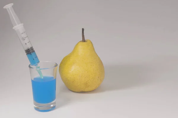 Yellow Pear Syringe Glass White Background Injection Blue Fluid — Stockfoto