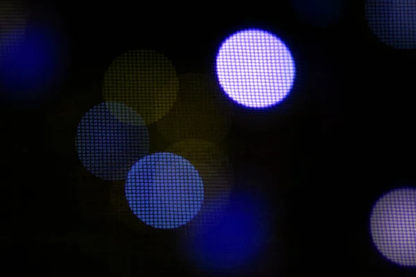 Colorful. Circular points. Blurred bright light. Defocused background. Bokeh abstract texture. 