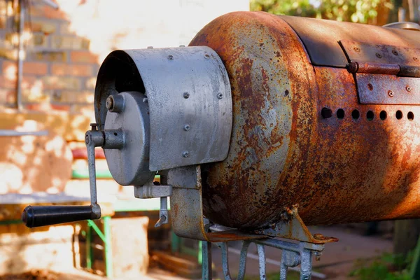Forced grill ventilation system.Homemade barbecue. Barbecue production technology.Old rusty brazier. Manual ventilation of the grill.
