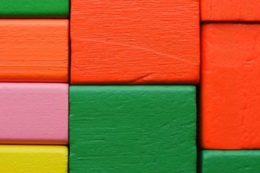 Color blocks. Multicolored wooden cubes. Multicolored blocks. Wooden blocks. Children's constructor. Building material.