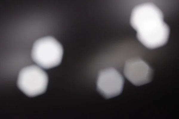 Monochrome bokeh. Abstract background. Defocused light. Abstract glow