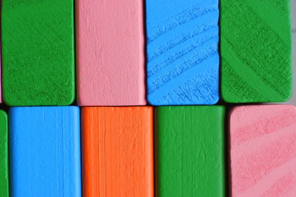 Color blocks. Multicolored wooden cubes. Multicolored blocks. Wooden blocks. Children's constructor. Building material.