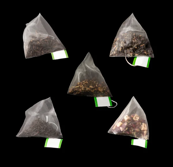 5 Luxury Pyramid Teabags isolated on Black — Stock Photo, Image
