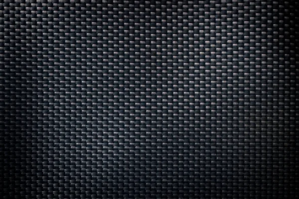 Mesh black texture. Dark polyester fiber material for sport cloth or abstract weave background. Synthetic pattern for backpacks and sports equipment