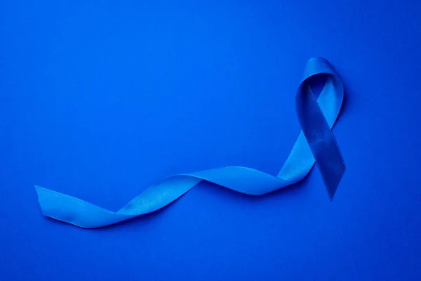 Premium Photo  Colorectal cancer awareness month, dark blue color ribbon  for supporting people living and illness.