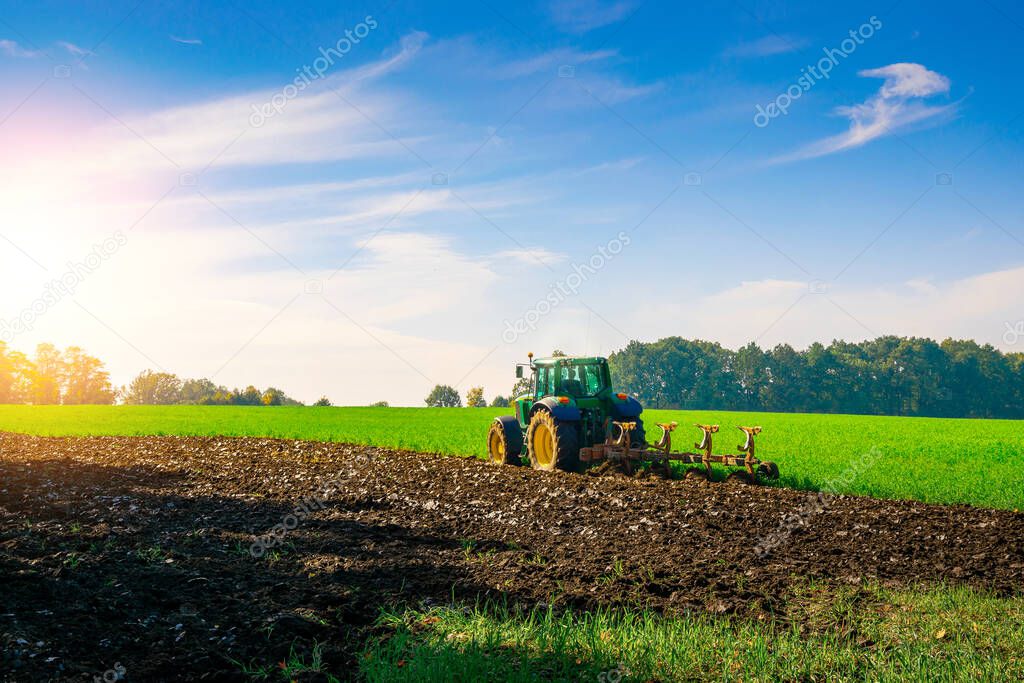Tractor harvest. Agriculture farm machinery on landscape land field. Farmer machine equipment for crop. Industrial farming concept
