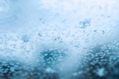 Dondurma makrosu. Soğuk kar arka planı. Mavi kristal donuk soyut desen. Beyaz buz dokusu