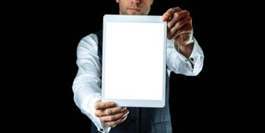 Mockup display. Empty blank tablet screen in businessman hand. Mock up smart device isolated on black banner background. Mockup for application, website design project