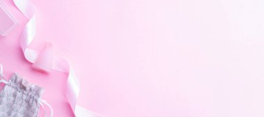 Menstrual cycle sanitary cup. Pink ribbon with menstrual cup. Menstruation feminine period. Sanitary hygiene banner. Use menstrual cup inside vagina