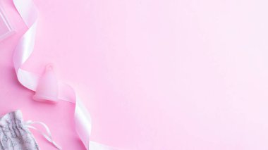 Menstrual cycle sanitary cup. Pink ribbon with menstrual cup. Menstruation feminine period. Sanitary hygiene banner. Use menstrual cup inside vagina