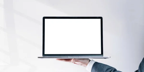 Laptop mockup computer screen. Businessman holding notebook. Empty blank mockup computer screen on white background. Monitor template for mock up