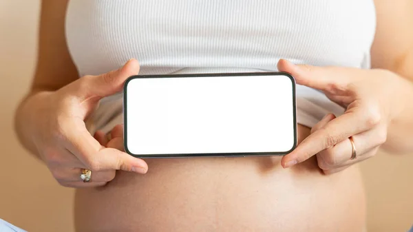 妊娠モックアップが表示されます 妊娠中の女性がスマホを持ってる モバイル妊娠オンライン妊産婦アプリケーションのモックアップ コンセプト妊産婦妊娠出産 — ストック写真
