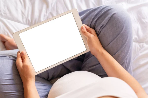 Pregnancy mockup display. Pregnant woman holding smart tablet. Mobile pregnancy online maternity application mock up. Concept maternity, pregnancy, childbirth