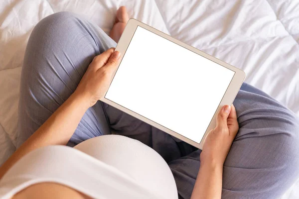 Pregnancy mockup display. Pregnant woman holding smart tablet. Mobile pregnancy online maternity application mock up. Concept maternity, pregnancy, childbirth