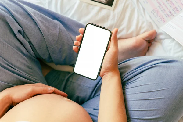 Pregnancy mockup app. Mobile pregnancy online maternity application. Pregnant mother using phone mock up. Pregnancy, medicine, pharmaceutics, health care and people concept