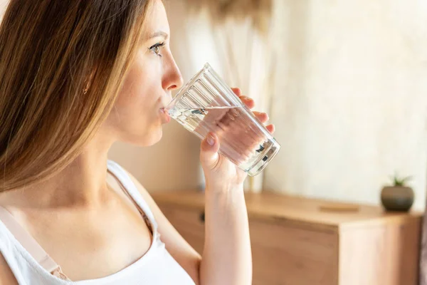 Pregnant drink water. Beautiful pregnancy drinking water. Happy pregnant lady holding glass of water. Pregnancy, maternity, healthcare concept