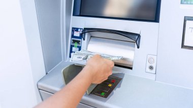 Atm card machine cash. Holding american bill cash. Woman withdraw money usd hundred dollar. Bank credit card money background