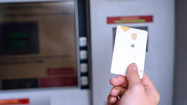 Atm machine screen. Hand holding money bank credit card. Withdraw money cash from atm. Money stack, bank credit card
