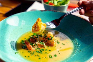 Seafood soup shrimp dish. Thai spicy prawn soup in plate. Thai shrimp curry food with creamy coconut milk