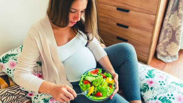 Pregnant healthy eating salad. Pregnancy woman eating nutrition healthy food. Healthy breakfast concept