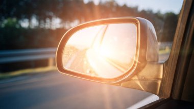 Road trip car mirror. Sun, highway car road reflection in mirror. Summer holidays trip concept