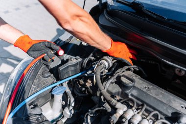 Car air conditioner ac repair service. Refill automobile ac compressor and checking auto conditioning system. Mechanic engine auto car service