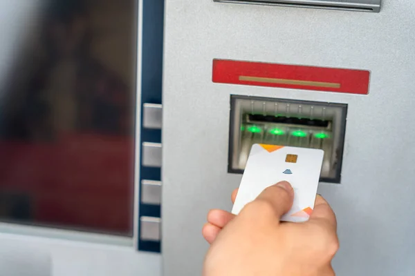 Atm card cash machine. Hand holding money bank credit card. Withdraw money cash from atm. Bank credit card money background