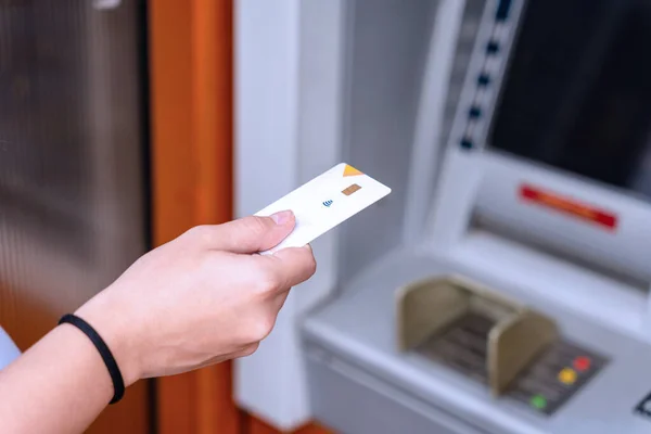 Atm machine cash. Money bank credit card holding hand. Withdraw money cash from atm. Bank credit card withdraw dollar bill