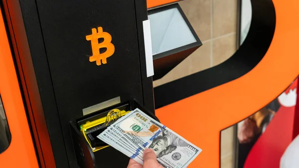 Atm cash bitcoin teller machine. Woman withdraw american dollar bill money. Usd hundred money payment on virtual crypto currency btc wallet. Bitcoin BTC ATM Cash Machine