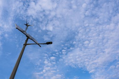 Wind turbines solar panels. Renewable photovoltaic technology with solar energy power panel and wind turbine. Solar energy panels power