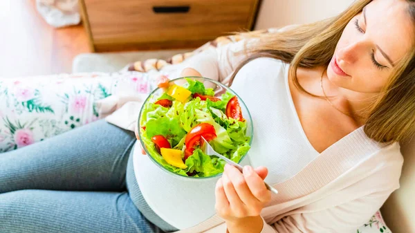Pregnant healthy eating salad. Pregnancy woman eating nutrition healthy food. Healthy breakfast concept