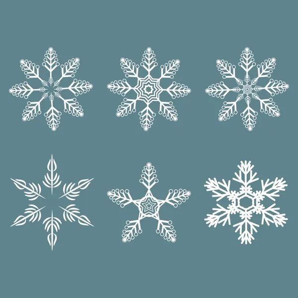 Noel tasarımı için vektör kar taneleri hazır. Cristmas için çeşitli kar taneleri ve mavi arka planda izole edilmiş yeni yıl aksesuarları.