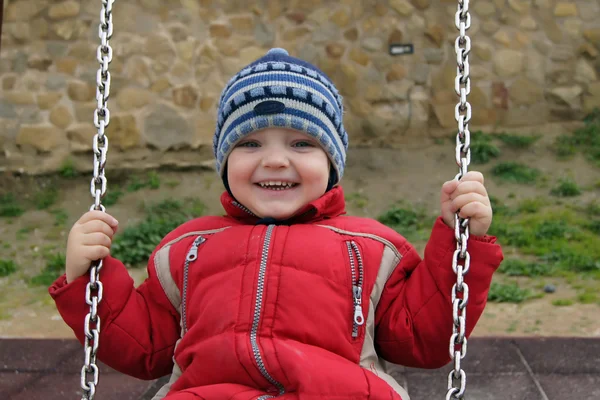 Child on a swing — Zdjęcie stockowe