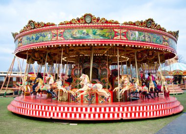 Colorful carousel in Reading Berkshire England clipart