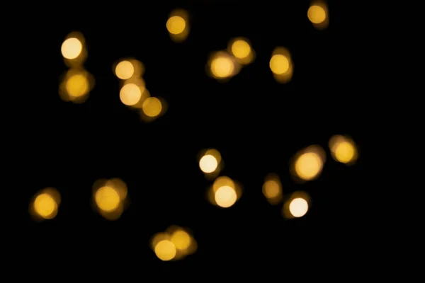Bokeh Χρυσά Φώτα Φόντο Θολή Φώτα Χριστουγεννιάτικη Γιρλάντα Απομονωμένη Μαύρο — Φωτογραφία Αρχείου