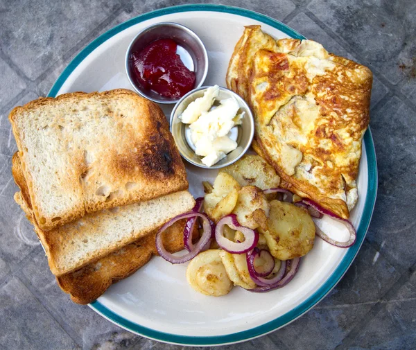 Yummy breakfast with omelette and potatoes — Stock Photo, Image