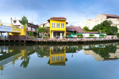 MELAKA, MALAYSIA - June 12, 2022: Colorful houses and hotels along Melaka river. Melaka city is a designated UNESCO world heritage site.